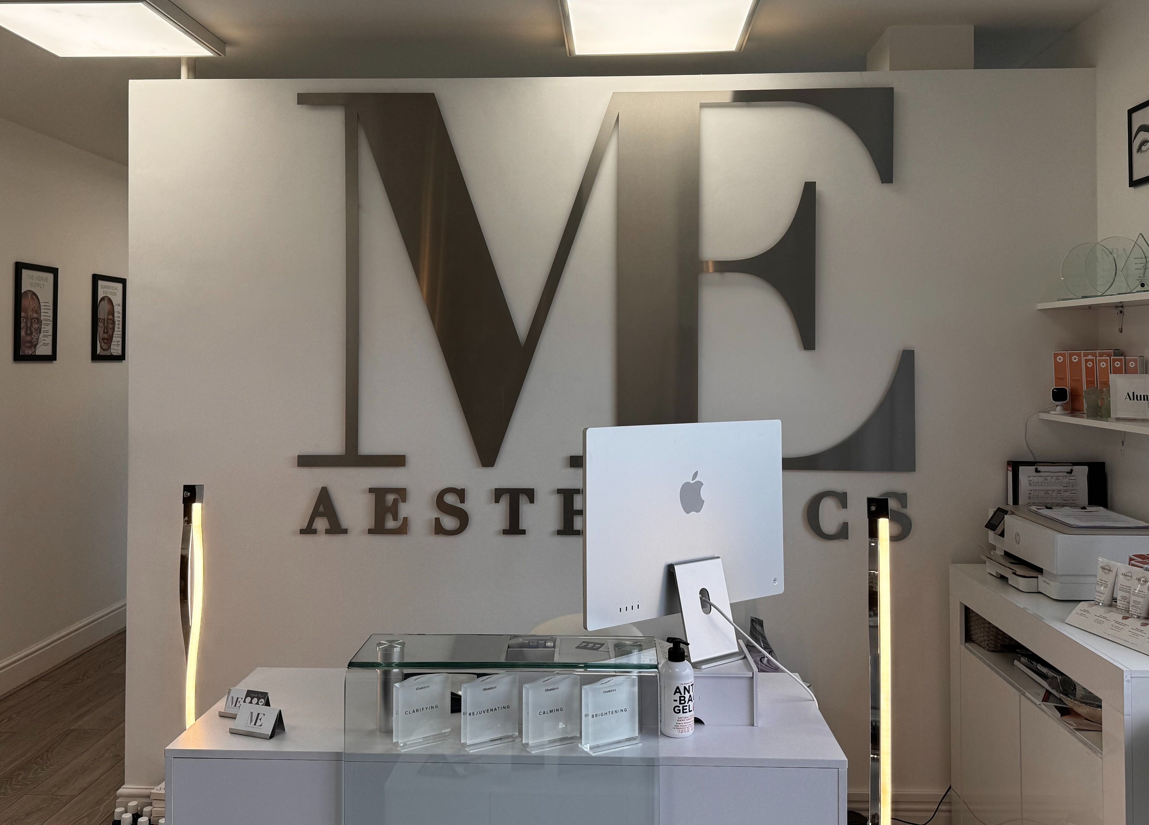 Reception area of Mollie Elise Aesthetics in Chorley, England, GB, featuring modern decor and skincare products.