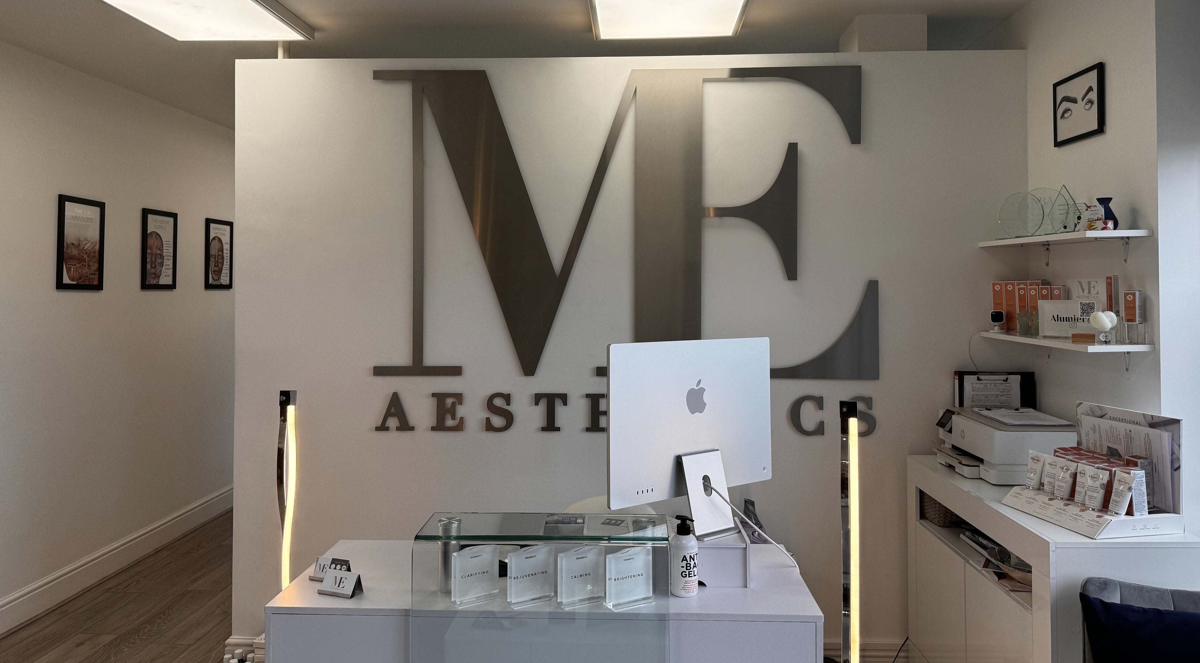 Reception area of Mollie Elise Aesthetics in Chorley, England, GB, featuring modern decor and skincare products.
