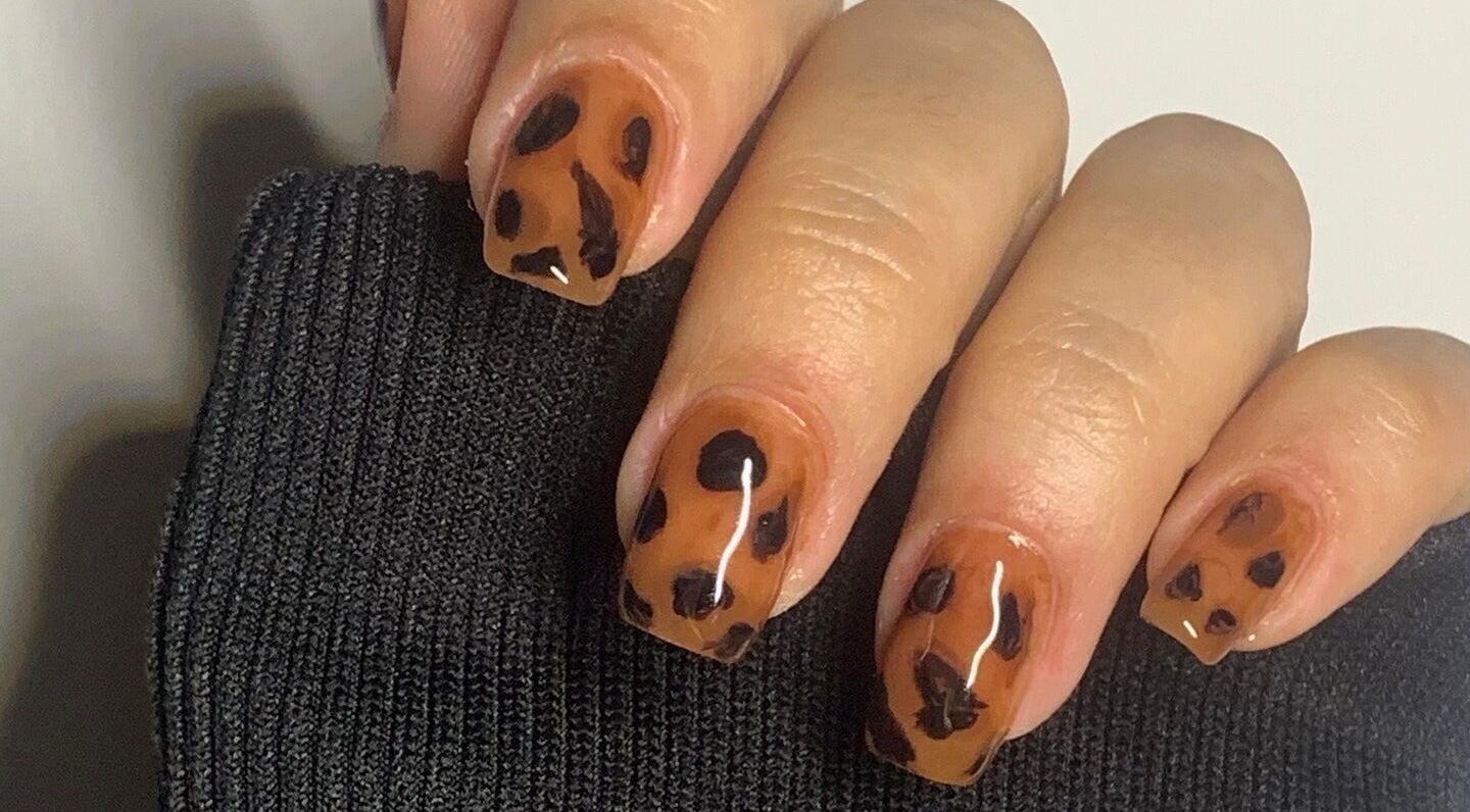 Brown and black leopard pattern nails at Eva's nails, London, England, GB.