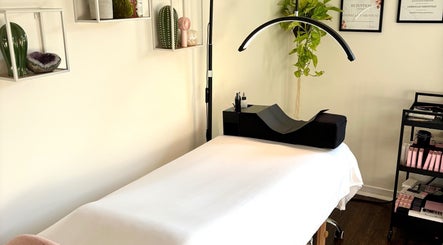 Lunaria Lash Loft treatment room in Barrie, Ontario, CA, featuring a cozy bed and organized beauty tools.