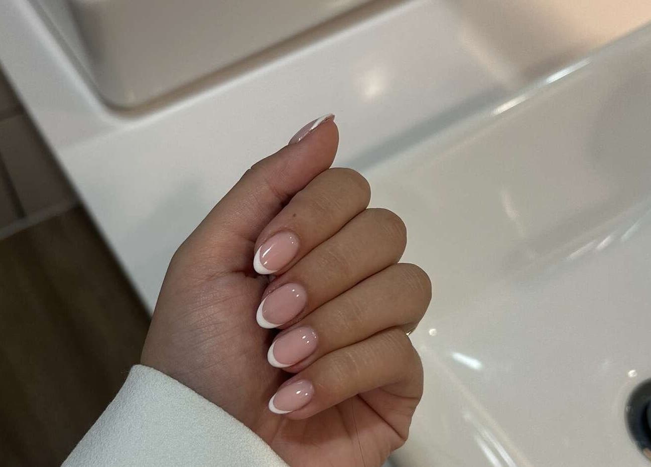 Elegant French manicure at Maybe Beauty Studio, Tadcaster, England, GB. Showcasing expert nail artistry.