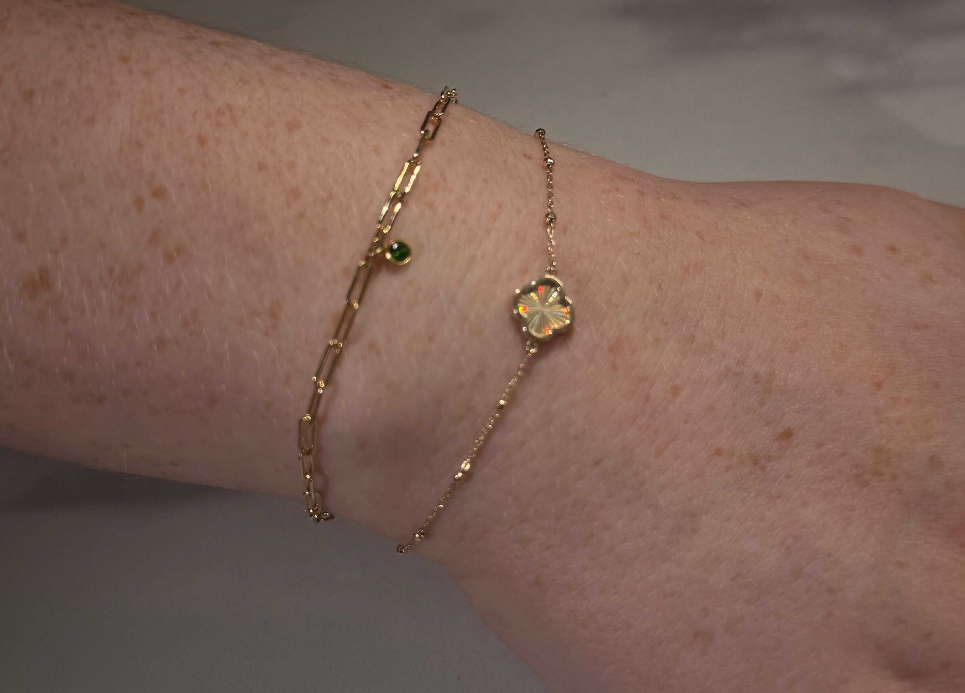Delicate gold bracelets on a wrist at Maybe Beauty Studio in Tadcaster, England, GB.