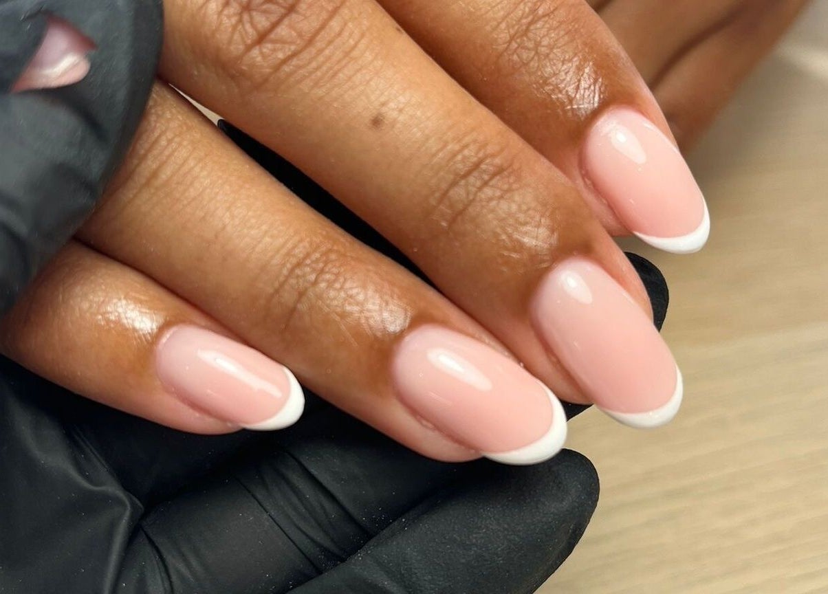 French manicure at Maybe Beauty Studio, Tadcaster, England, GB, showcasing glossy pink nails with white tips.
