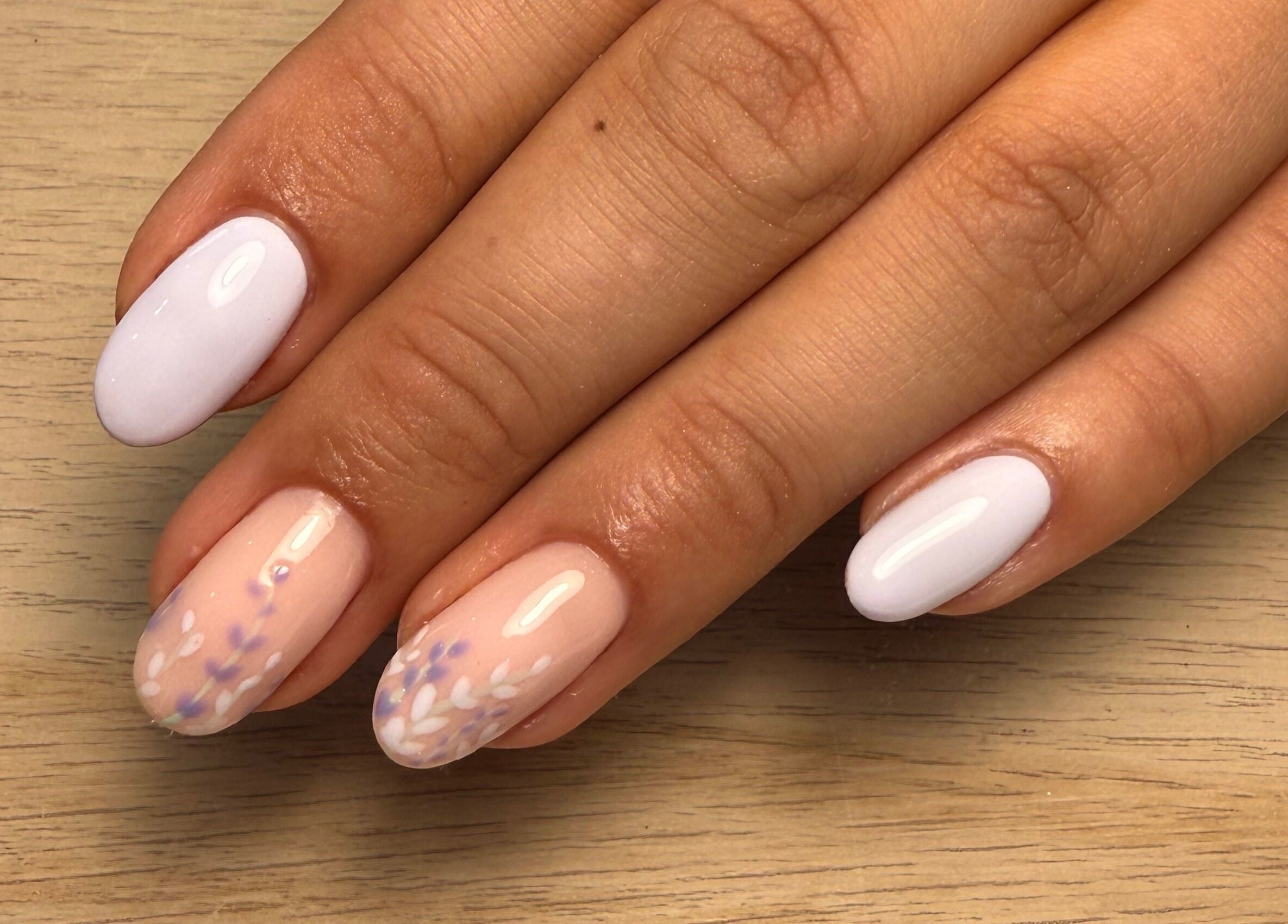 Floral nail art design at Maybe Beauty Studio, Tadcaster, England, GB featuring pastel shades.