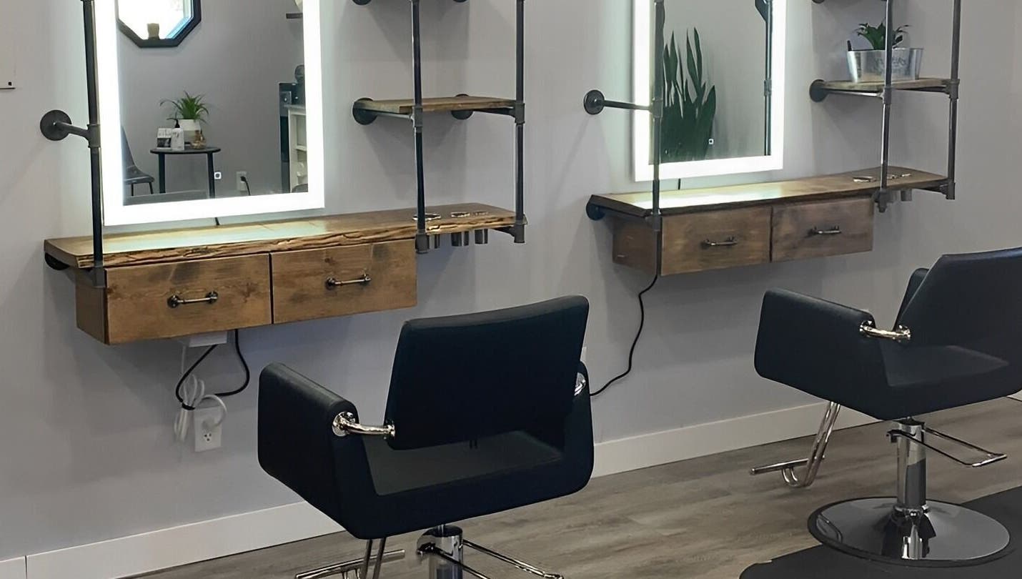 Modern styling chairs and mirrors at T'Hairapy Studio in Kenosha, Wisconsin, US.