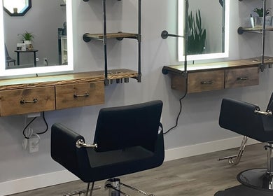 Modern styling chairs and mirrors at T'Hairapy Studio in Kenosha, Wisconsin, US.