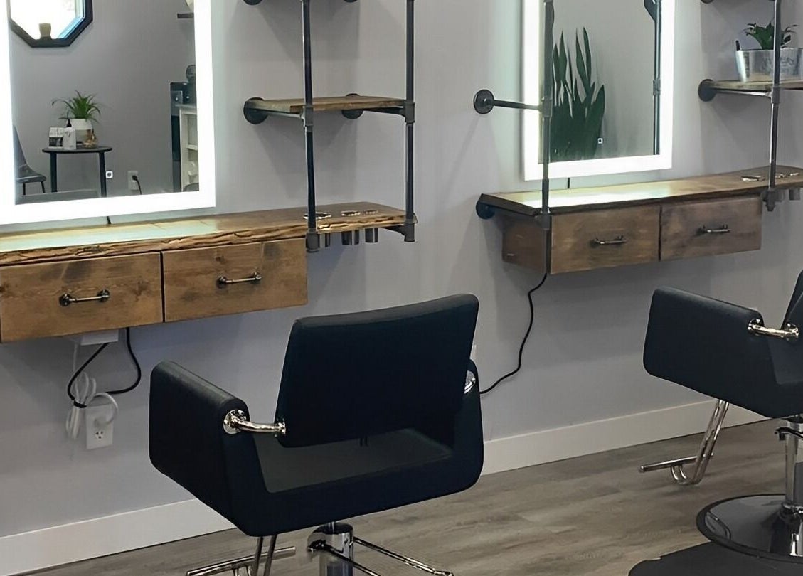 Modern styling chairs and mirrors at T'Hairapy Studio in Kenosha, Wisconsin, US.