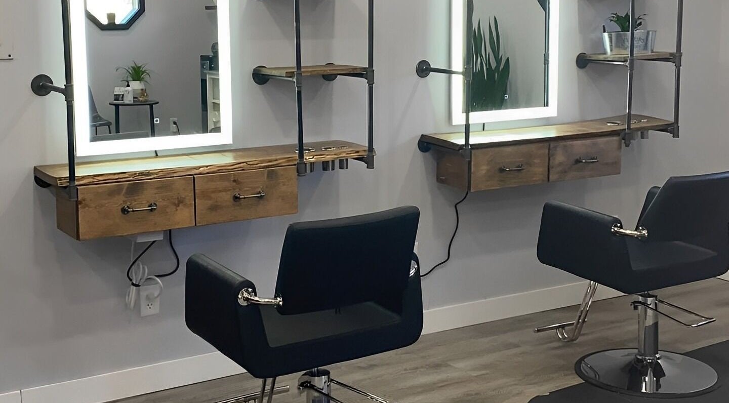 Modern styling chairs and mirrors at T'Hairapy Studio in Kenosha, Wisconsin, US.