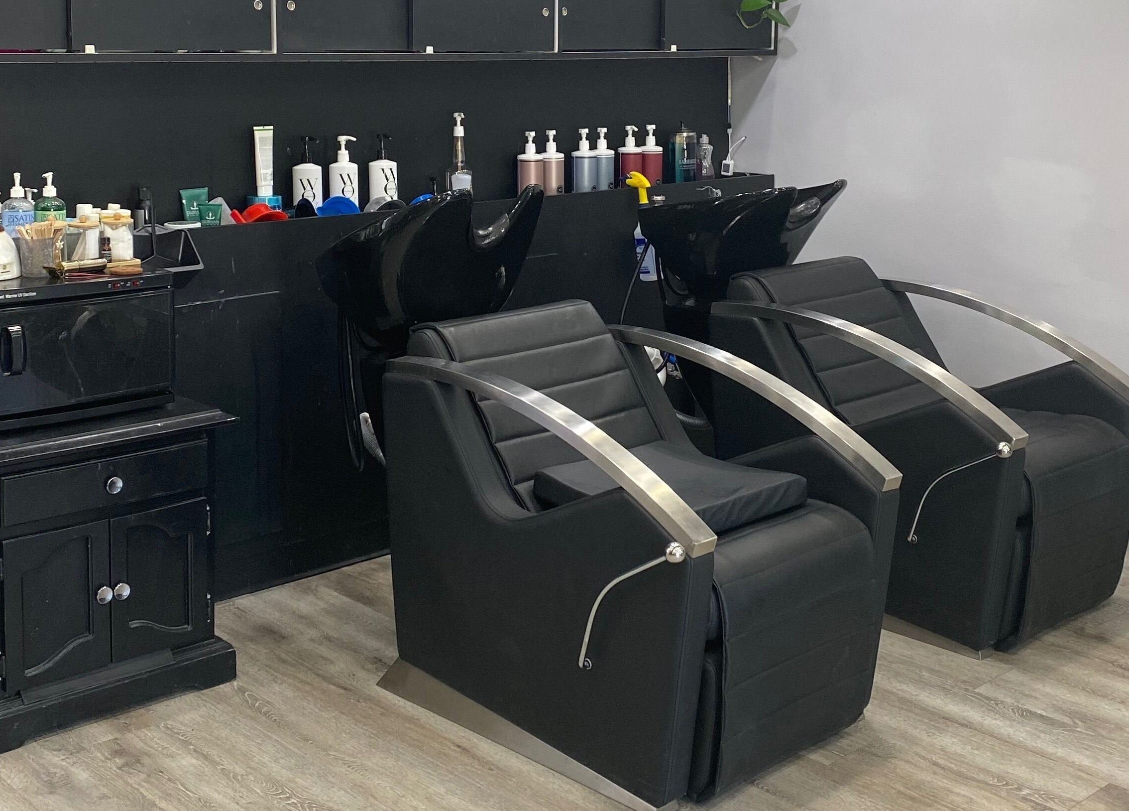 Modern salon chairs and products at T'Hairapy Studio, Kenosha, Wisconsin, US, offering premium beauty care.