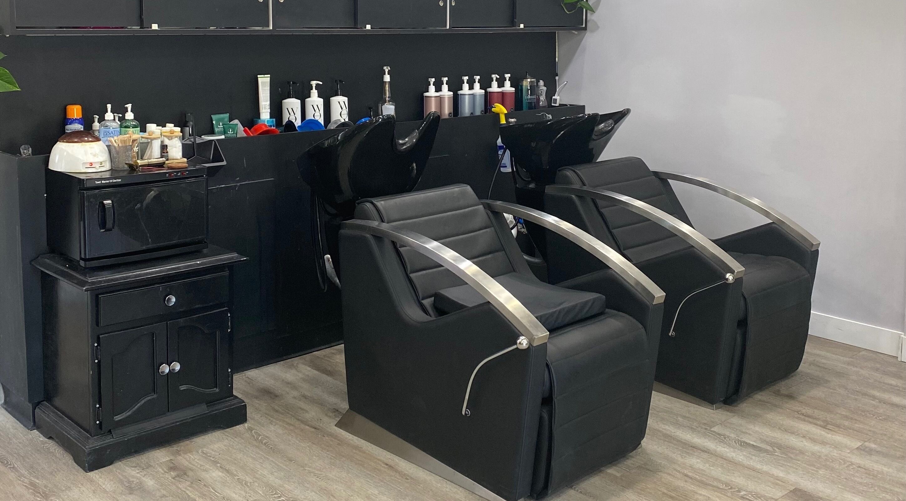 Modern salon chairs and products at T'Hairapy Studio, Kenosha, Wisconsin, US, offering premium beauty care.