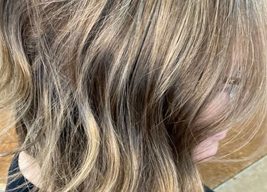 Golden brown wavy hairstyle at T'Hairapy Studio, Kenosha, Wisconsin, US.