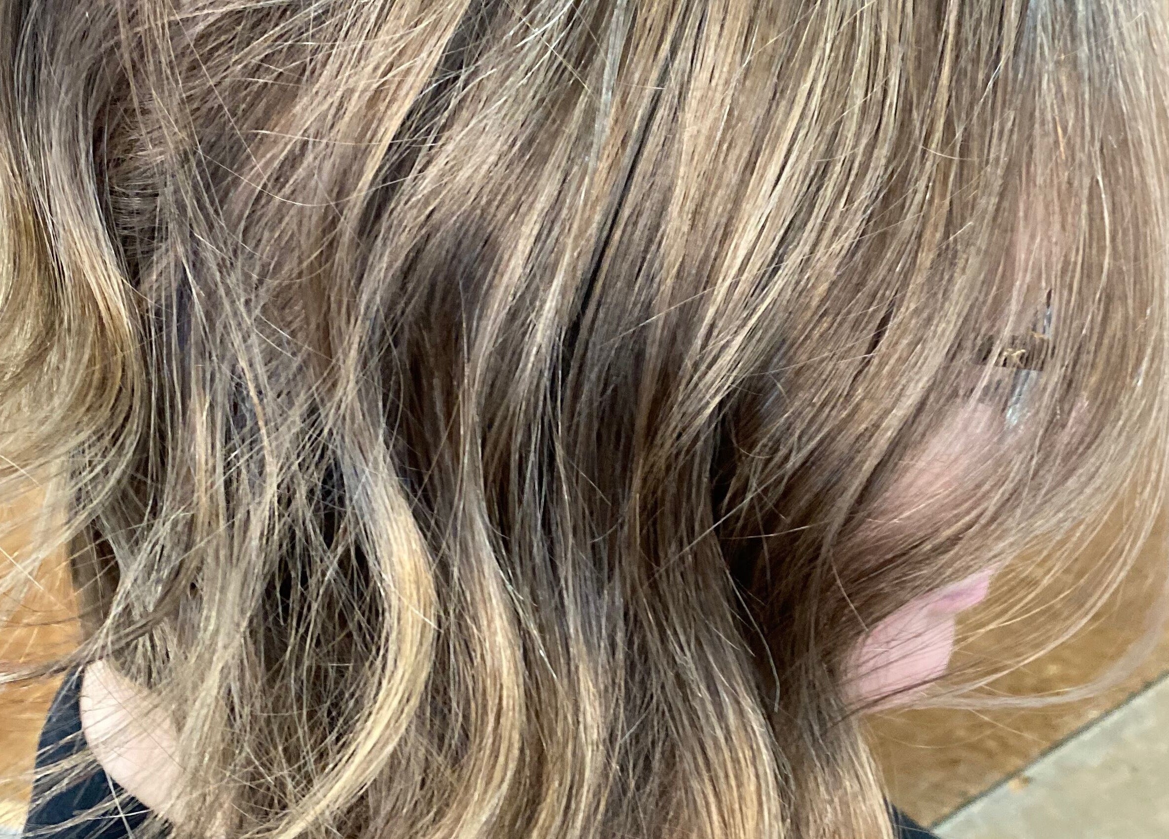 Golden brown wavy hairstyle at T'Hairapy Studio, Kenosha, Wisconsin, US.