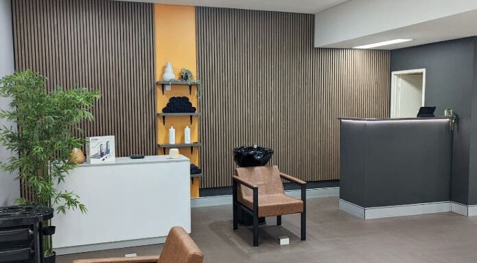 Chic interior of Cuts By Carella in Cairns City, Queensland, AU with modern decor and welcoming atmosphere.