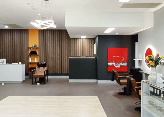 Modern, chic salon interior at Cuts By Carella in Cairns City, Queensland, AU with stylish decor and seating.