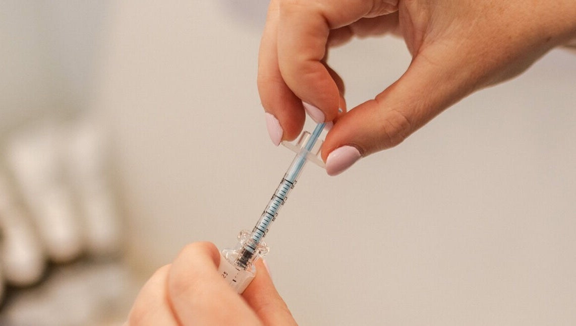 Close-up of injection being prepared at Beautiful is You Ltd - Waihi, Waihi Beach, Bay Of Plenty Region, NZ.