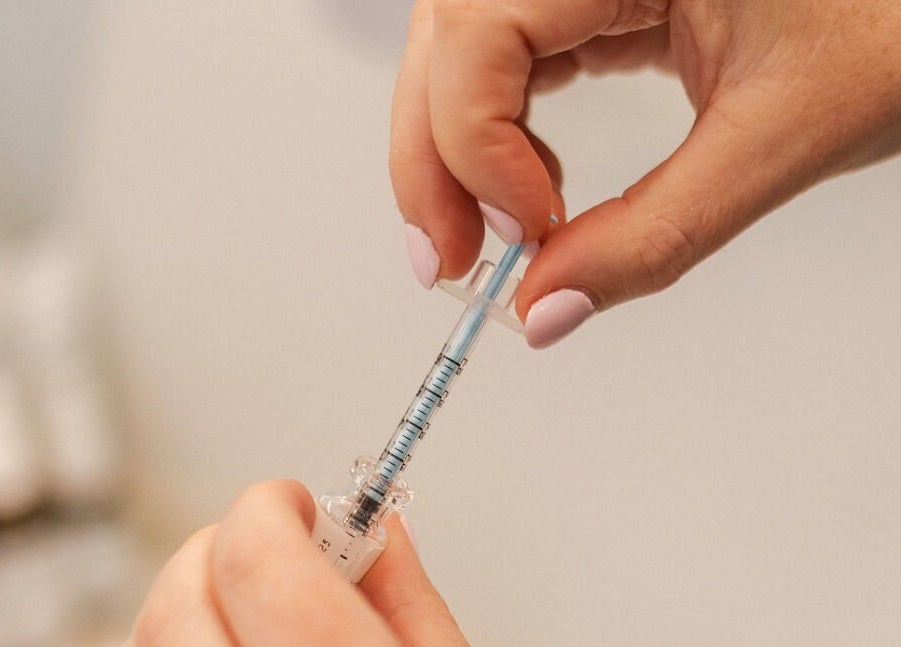 Close-up of injection being prepared at Beautiful is You Ltd - Waihi, Waihi Beach, Bay Of Plenty Region, NZ.