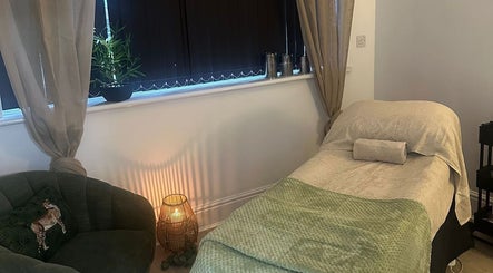 Tranquil spa room at Bamboo in Mansfield, England, GB with comfy chair and massage bed.