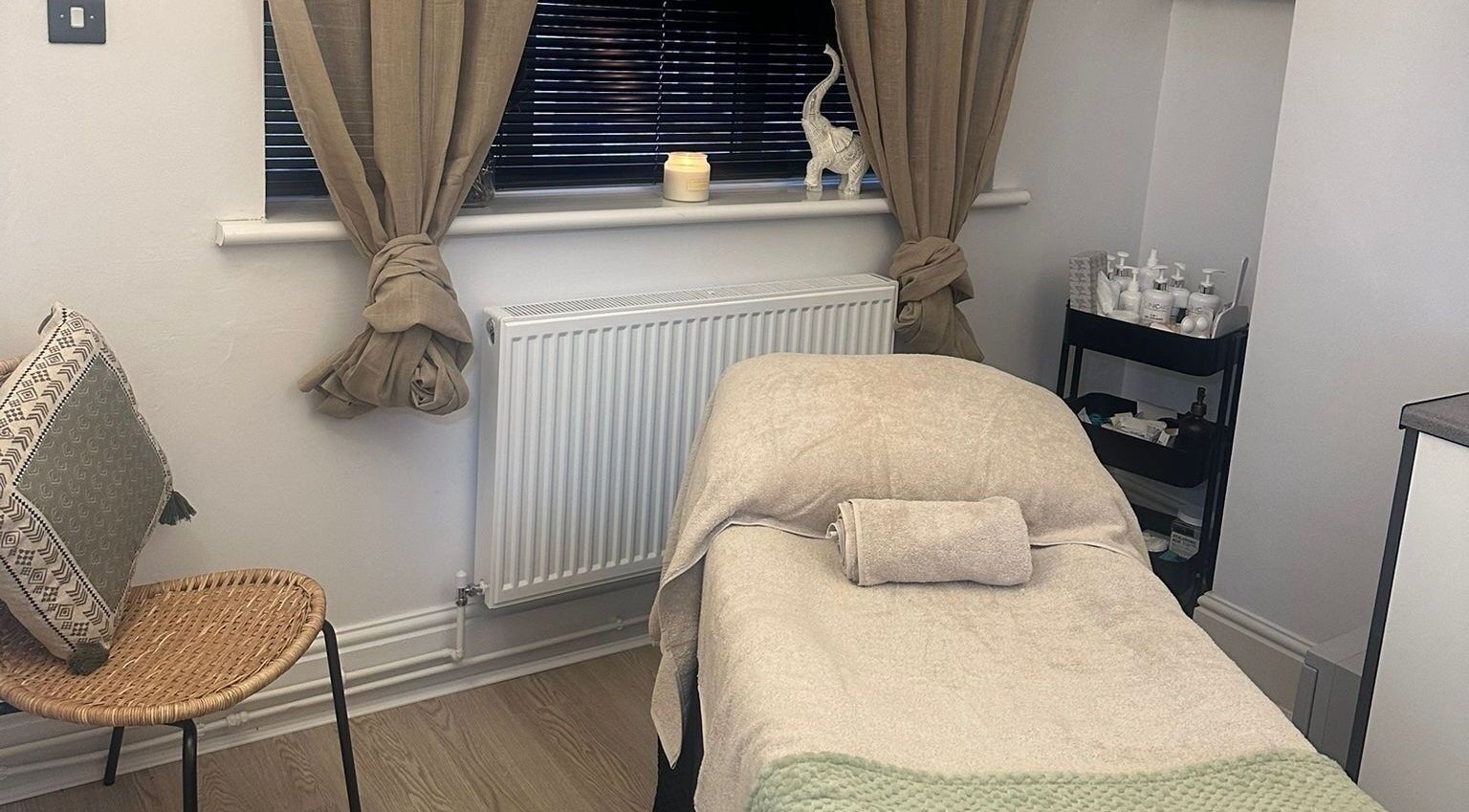 Relaxing treatment room at Bamboo in Mansfield, England, GB, featuring a massage bed and tranquil decor.