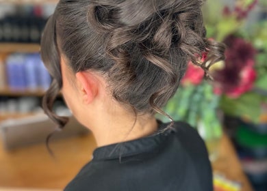 Elegant updo hairstyle at Adele Branch Hair, Kirkintilloch, Scotland, GB, showcasing sophisticated curls.