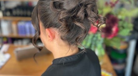 Elegant updo hairstyle at Adele Branch Hair, Kirkintilloch, Scotland, GB, showcasing sophisticated curls.