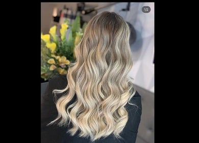 Blonde wavy hairstyle done at Adele Branch Hair in Kirkintilloch, Scotland, GB, showcasing expert styling.