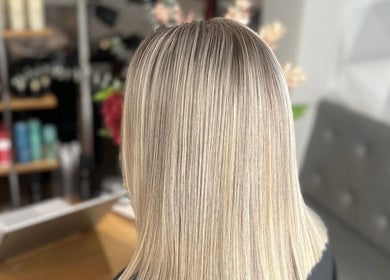 Sleek blonde hair at Adele Branch Hair, Kirkintilloch, Scotland, GB, showcasing a professional style.