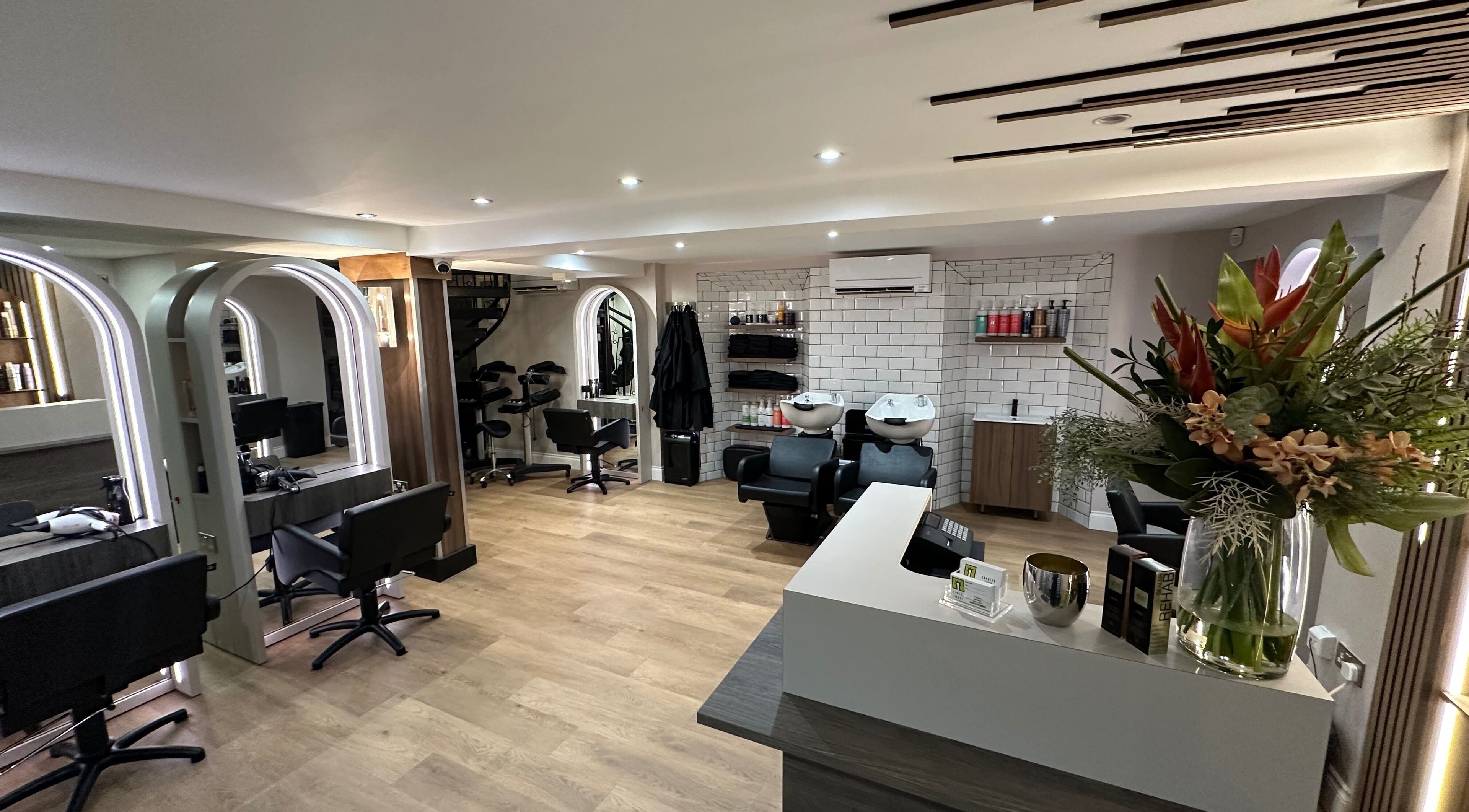 Interior of Adele Branch Hair, a modern salon in Kirkintilloch, Scotland, GB with sleek styling chairs and decor.