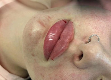 Close-up of polished lips at Boujee B*tch Aesthetics, Southampton, England, GB.