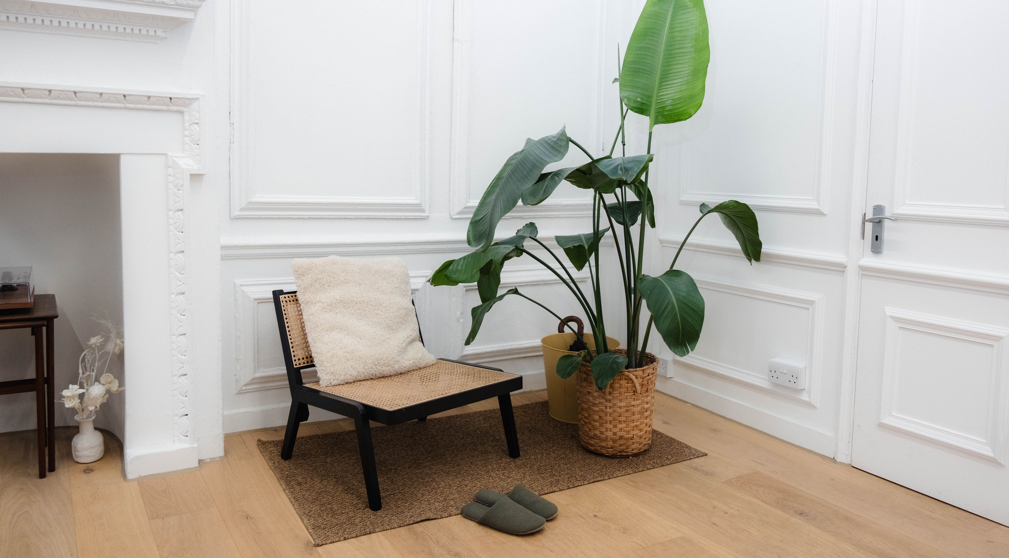 Cozy chair and plant arrangement at Nayii Atelier奈野, London, England, GB, offering a tranquil ambiance.