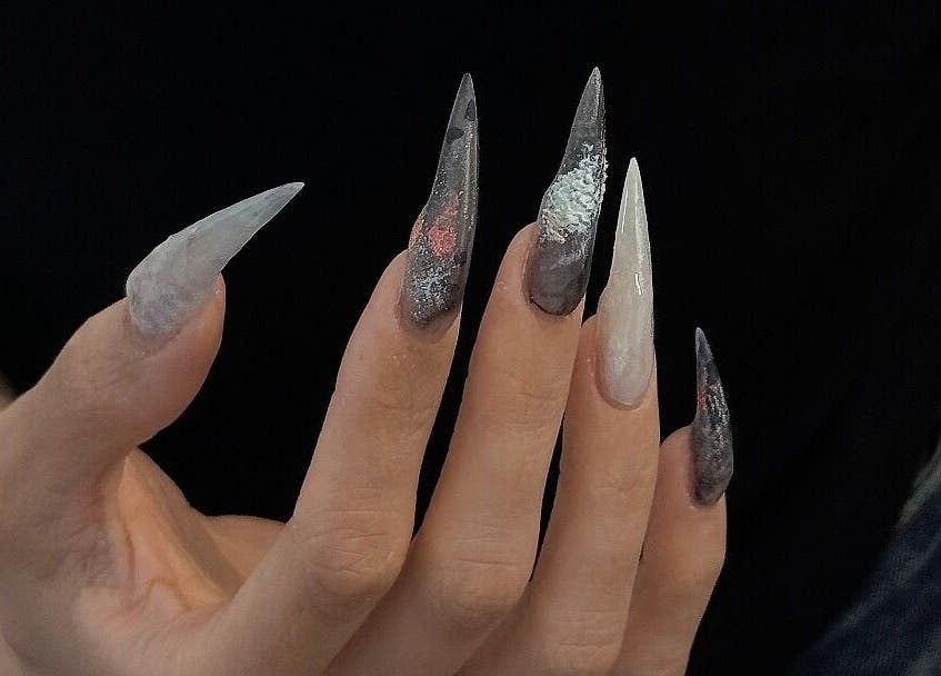 Intricate nail art at Nayii Atelier奈野, London, England, GB showcasing bold, pointed designs.
