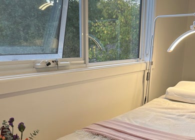 A tranquil spa bed at BBA - Beauty By Aileah, Melbourne, Victoria, AU, next to a sunlit window.