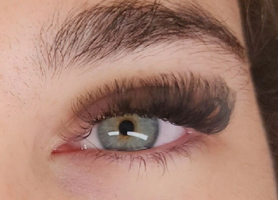 Close-up of enhanced eyelashes at Aisling Studio, East Mackay, Queensland, AU offering expert beauty services.