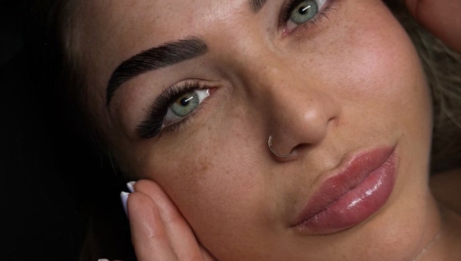 Close-up of a woman's face showcasing eyebrow and lip enhancement at Gyulya Yelaiah Beauty and Academy, Dublin, IE.