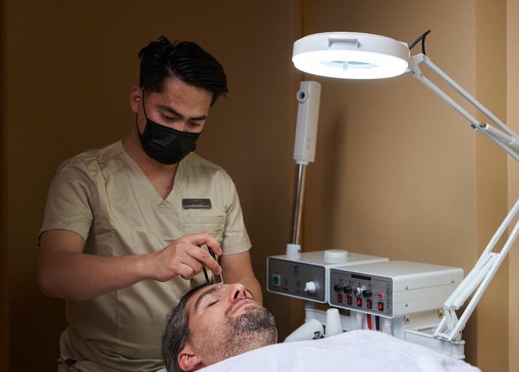 Aesthetician providing facial treatment at Via Sand Spa | Men, Riyadh, Riyadh Province, SA.