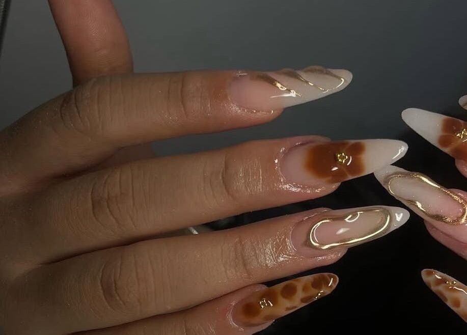 Elegant nail art design at HC BEAUTY in Rossendale, England, GB, featuring glossy and ornate patterns.