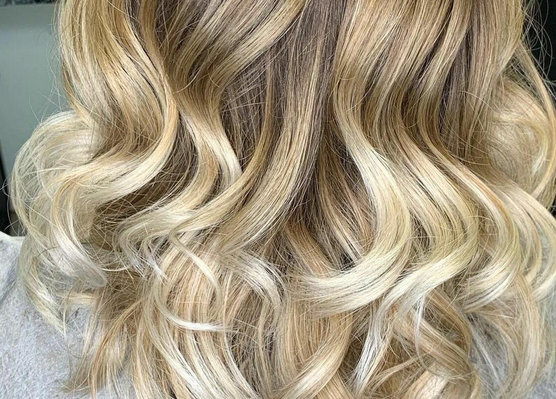 Blonde wavy hairstyle at Hair'N Dip-ity, Littlestown, Pennsylvania, US.