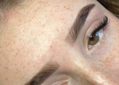 Close-up of expertly shaped eyebrow at EM Beauty And Massage, Dereham, England, GB showcasing precise artistry.