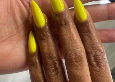 Bright yellow nails styled at Rasheedas Tips And Toes, Montego Bay, St. James, JM.