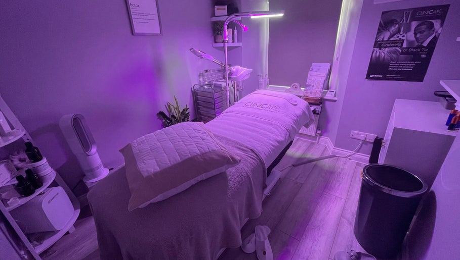 Relaxing treatment room at The Renewed Lab in Harrold, England, GB with purple ambiance and clean aesthetic.