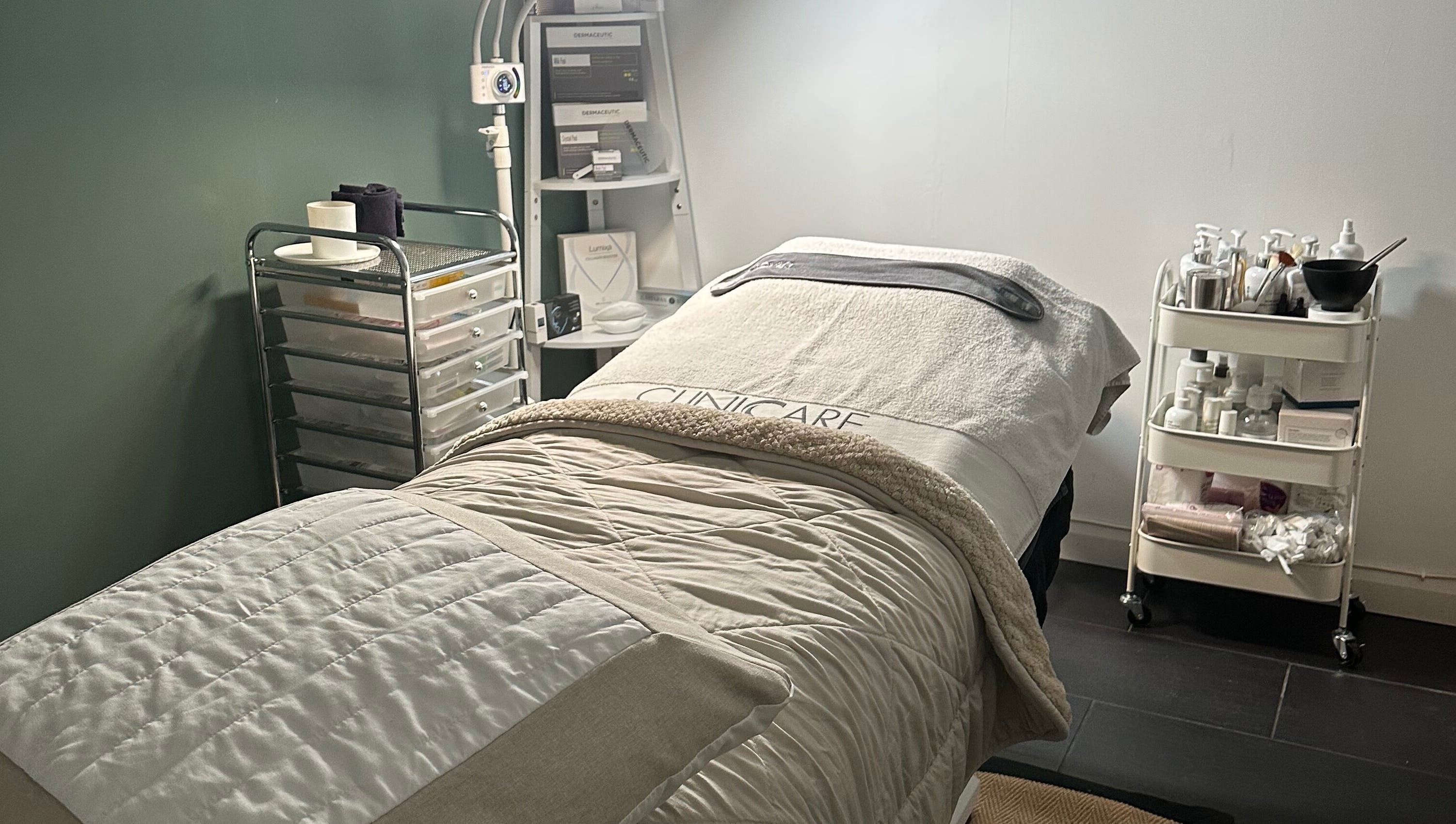 Cozy treatment room at The Renewed Lab in Harrold, England, GB, with a comfy bed and wellness tools.