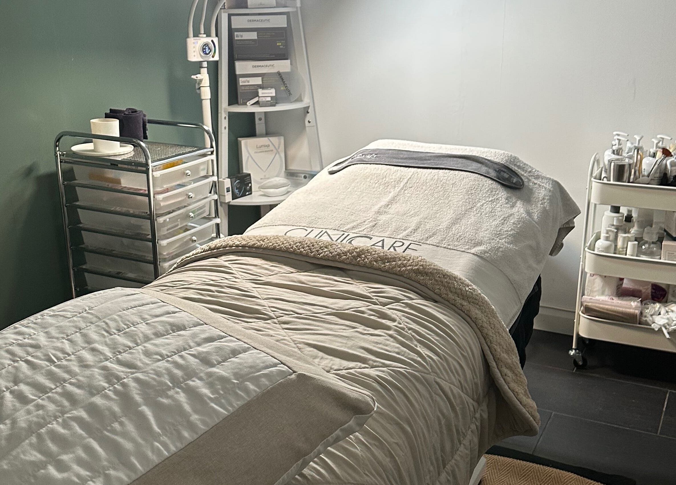 Cozy treatment room at The Renewed Lab in Harrold, England, GB, with a comfy bed and wellness tools.