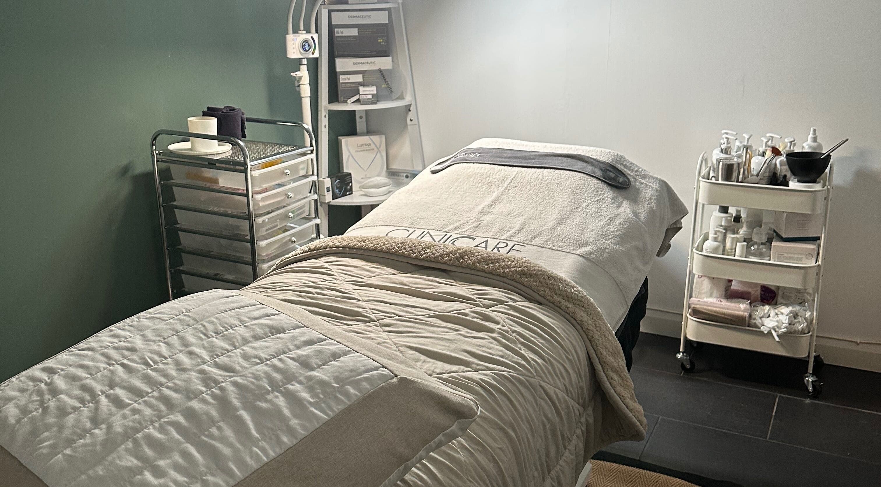 Cozy treatment room at The Renewed Lab in Harrold, England, GB, with a comfy bed and wellness tools.