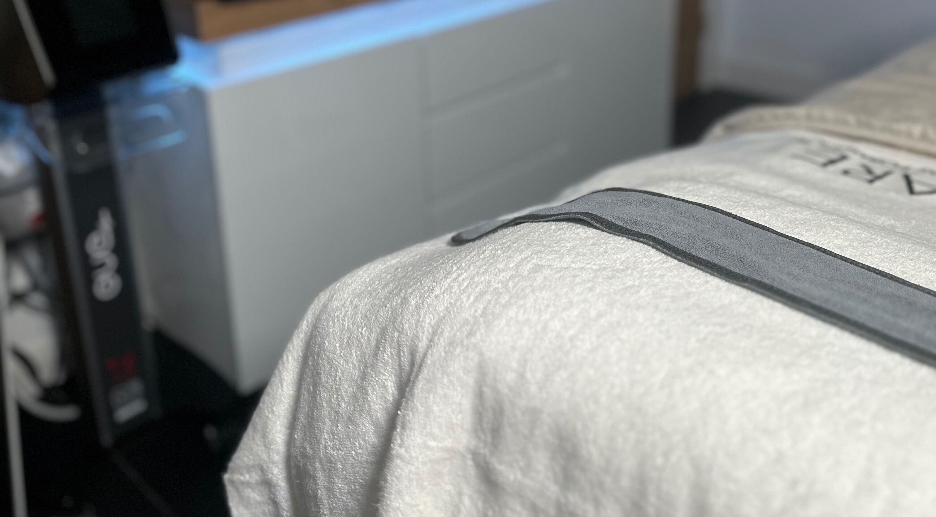 Relaxing massage table at The Renewed Lab in Harrold, England, GB, showcasing a cozy, peaceful atmosphere.