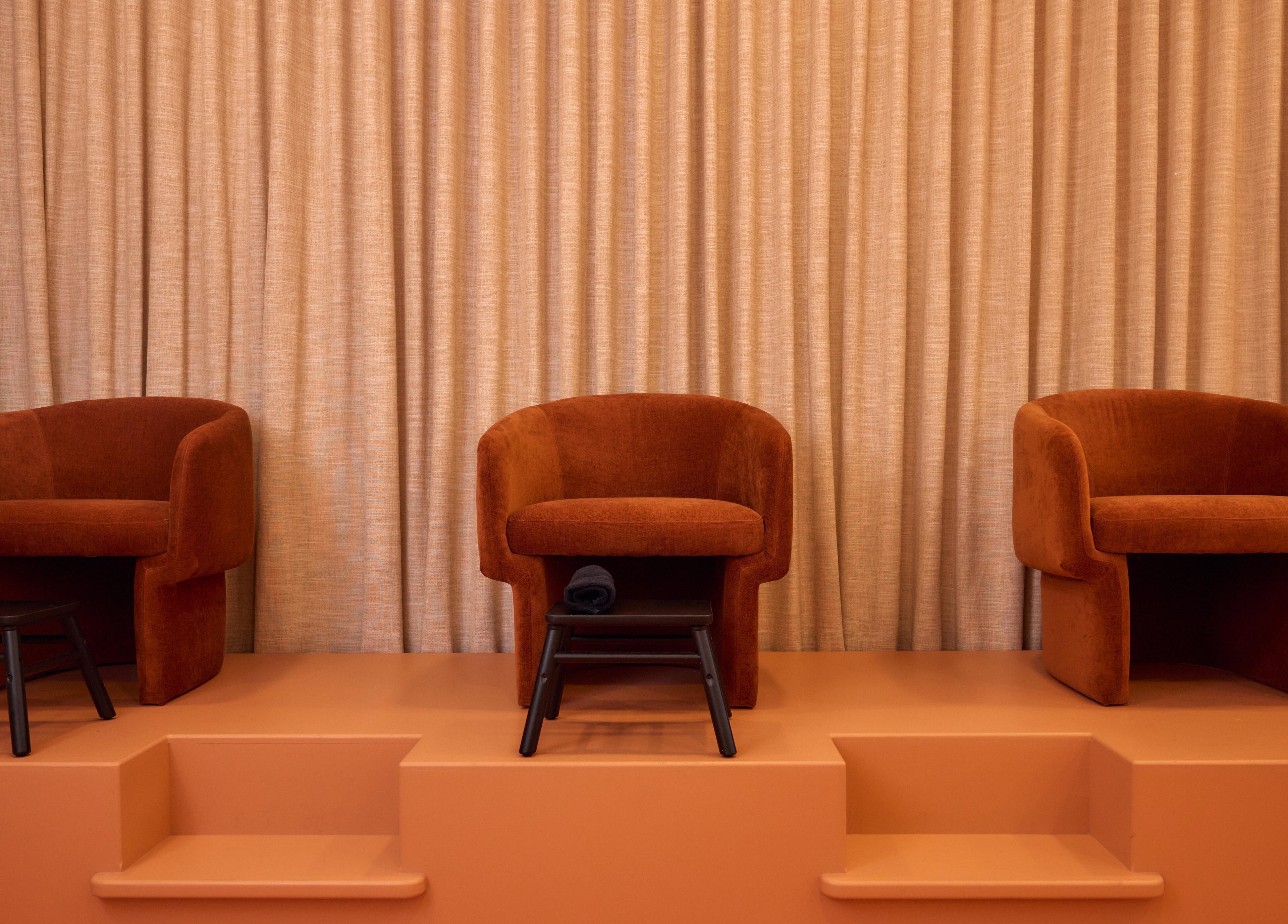 Elegant rust chairs at Painted, Darlinghurst, New South Wales, AU, offering a cozy and inviting ambience.