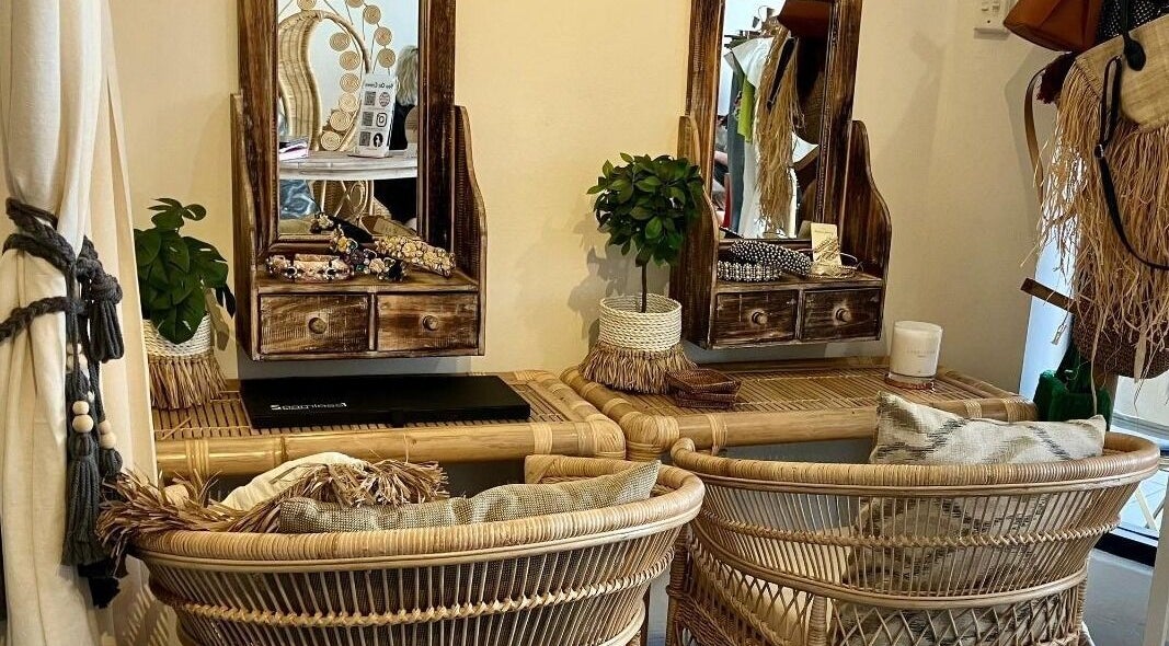 Cozy rattan chairs and rustic mirrors at You On Crown, Redfern, New South Wales, AU, perfect for wellness retreats.