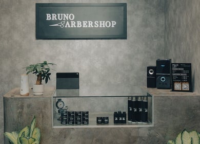 Stylish barber shop counter at 74 Jalan Air Itam, Dato Keramat, George Town, Pulau Pinang, MY with products displayed.