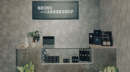 Stylish barber shop counter at 74 Jalan Air Itam, Dato Keramat, George Town, Pulau Pinang, MY with products displayed.