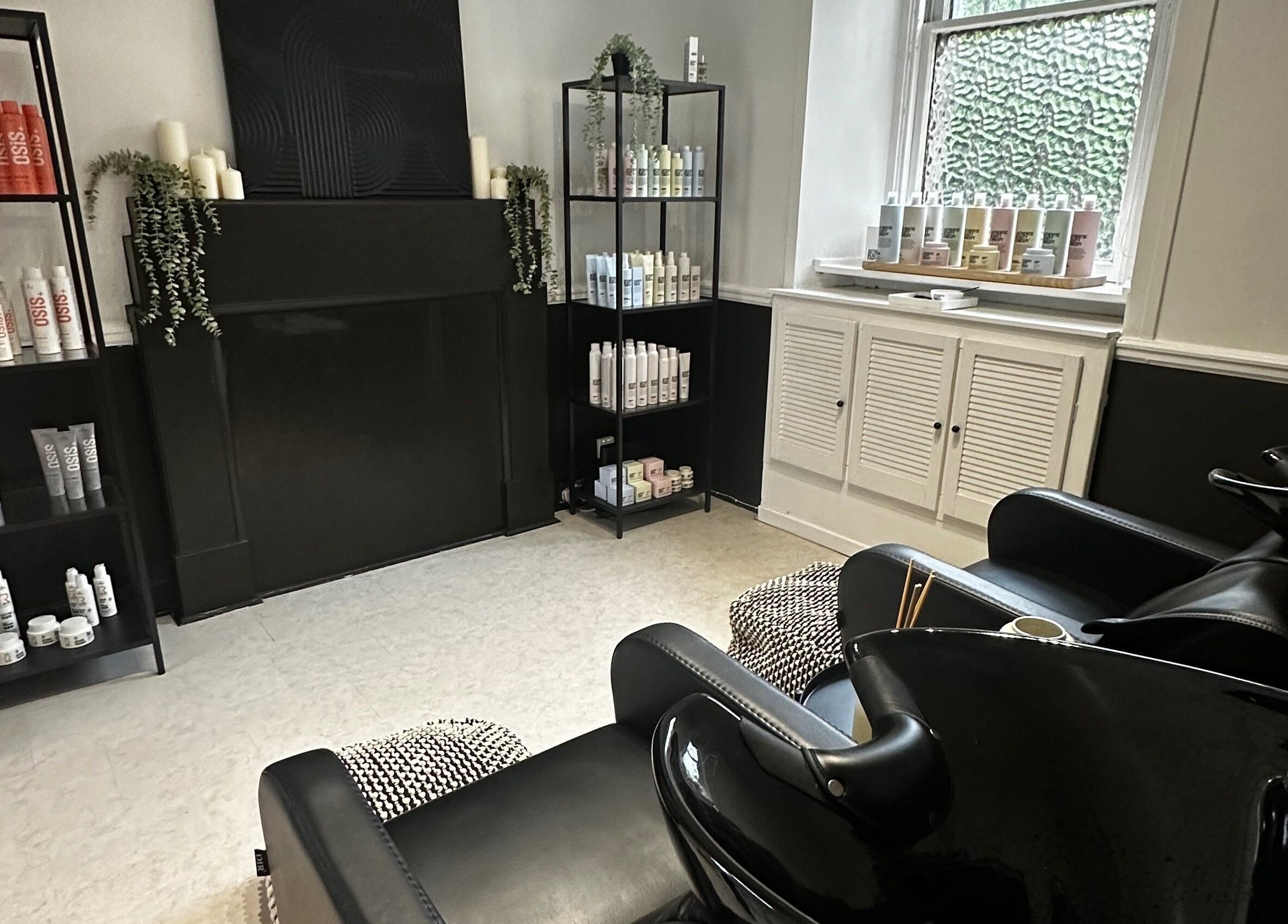 Luxurious beauty station at Exhibit Studio, Uphall, Scotland, GB, with sleek chairs and top-tier products.