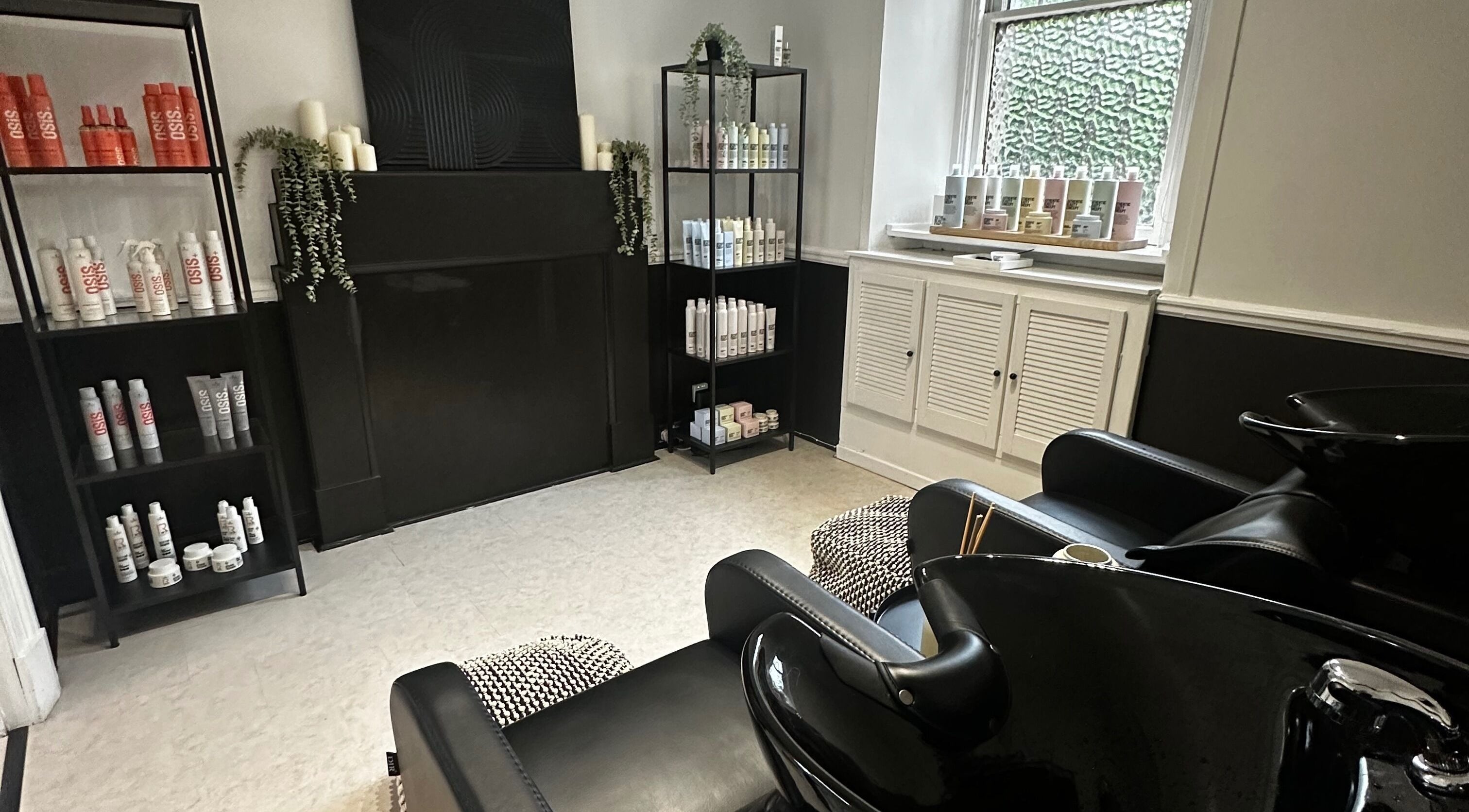 Luxurious beauty station at Exhibit Studio, Uphall, Scotland, GB, with sleek chairs and top-tier products.