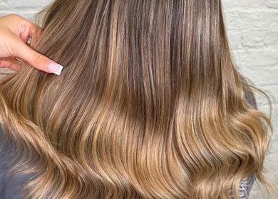 Elegant blonde waves at Molly May Extensions Hair Salon, Gainsborough, England, GB.